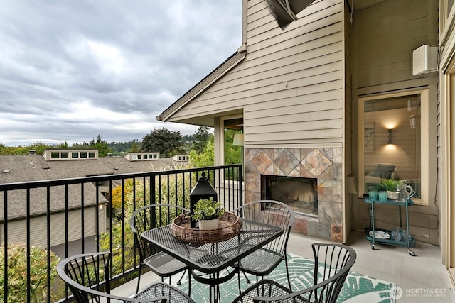 10036 NE 115th Ln Unit A3, Kirkland, WA 98033 - balcony featuring a fireplace