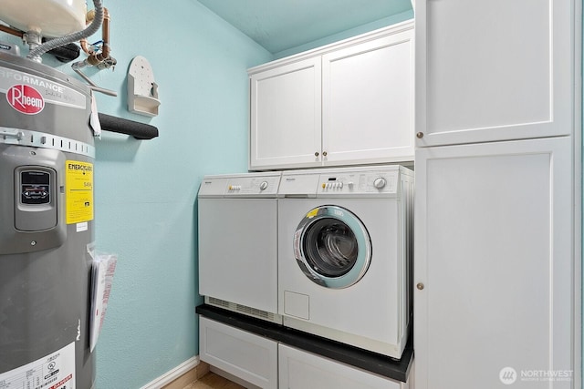 10036 NE 115th Ln Unit A3, Kirkland, WA 98033 - laundry area featuring cabinet space, electric water heater, and washing machine and clothes dryer