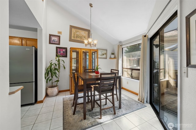 4051 S 159th Ln, Tukwila, WA 98188 - dining area with light tile patterned flooring, a chandelier, and high vaulted ceiling