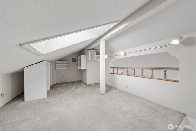 4051 S 159th Ln, Tukwila, WA 98188 - additional living space with a skylight, vaulted ceiling, and carpet floors