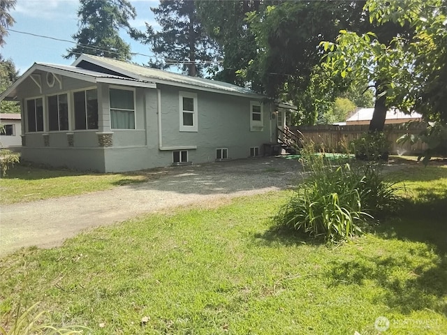 306 Henderson Way E, Tonasket, WA 98855 - view of side of home featuring a metal roof