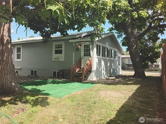 306 Henderson Way E, Tonasket, WA 98855 - rear view of property featuring a lawn and entry steps