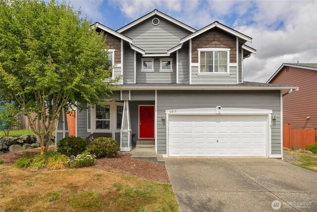 6815 278th St NW, Stanwood, WA 98292 - craftsman inspired home with driveway, an attached garage, and covered porch