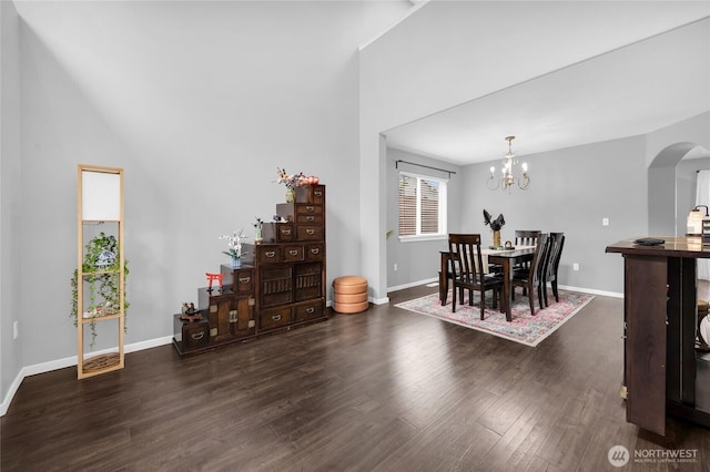 6815 278th St NW, Stanwood, WA 98292 - dining space with arched walkways, wood finished floors, and a chandelier
