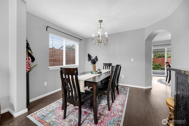 6815 278th St NW, Stanwood, WA 98292 - dining area featuring arched walkways, wood finished floors, and a chandelier