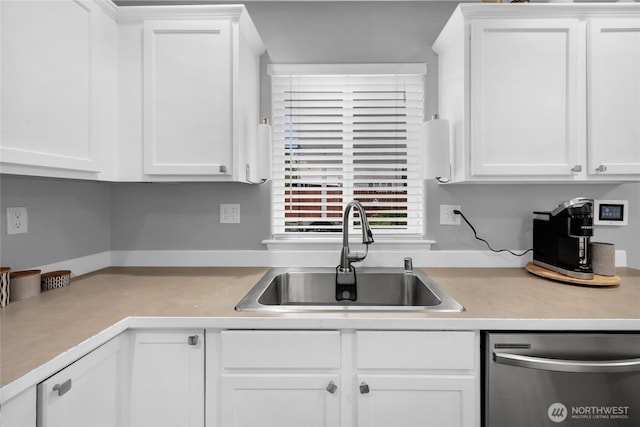 6815 278th St NW, Stanwood, WA 98292 - kitchen with stainless steel dishwasher, light countertops, and white cabinets