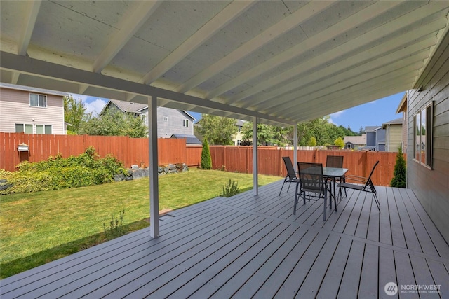 6815 278th St NW, Stanwood, WA 98292 - wooden terrace with outdoor dining area and a fenced backyard