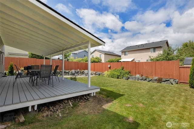 6815 278th St NW, Stanwood, WA 98292 - fenced backyard with a wooden deck and outdoor dining space