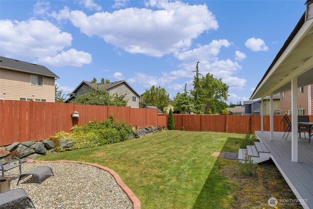 6815 278th St NW, Stanwood, WA 98292 - fenced backyard featuring a wooden deck