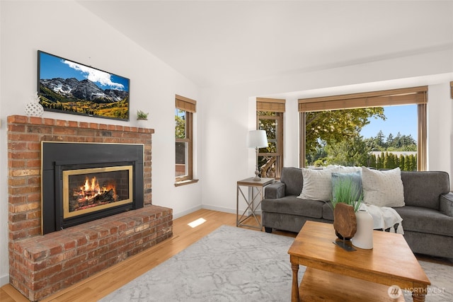 8833 47th Pl W, Mukilteo, WA 98275 - living room with a brick fireplace and wood finished floors