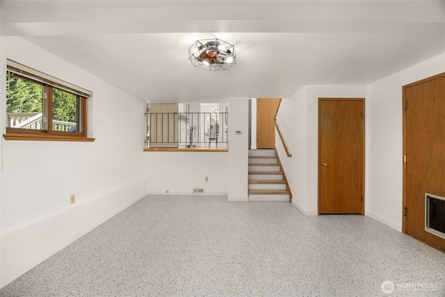 8833 47th Pl W, Mukilteo, WA 98275 - unfurnished living room featuring stairway and speckled floor