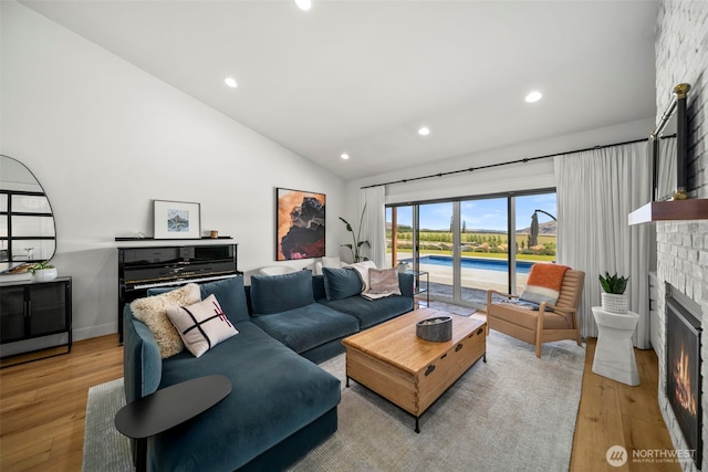 451S Partridge Ln, East Wenatchee, WA 98802 - living area with lofted ceiling, wood finished floors, a fireplace, and recessed lighting