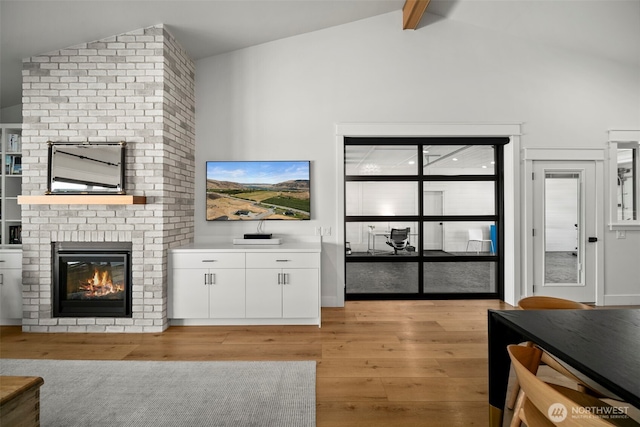 451S Partridge Ln, East Wenatchee, WA 98802 - living area with a fireplace, light wood-type flooring, beam ceiling, and high vaulted ceiling
