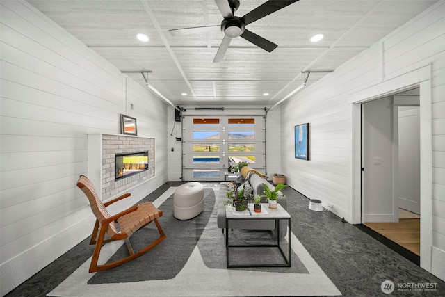 451S Partridge Ln, East Wenatchee, WA 98802 - living area with a ceiling fan, a brick fireplace, and wooden walls