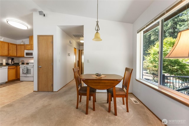 81 E Dunoon Pl, Shelton, WA 98584 - dining space featuring plenty of natural light, light colored carpet, and vaulted ceiling