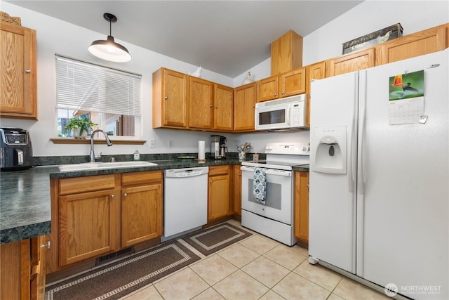 81 E Dunoon Pl, Shelton, WA 98584 - kitchen with white appliances, dark countertops, vaulted ceiling, light tile patterned flooring, and decorative light fixtures