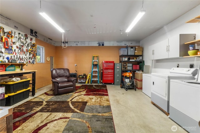 81 E Dunoon Pl, Shelton, WA 98584 - living area featuring separate washer and dryer, concrete flooring, and a workshop area
