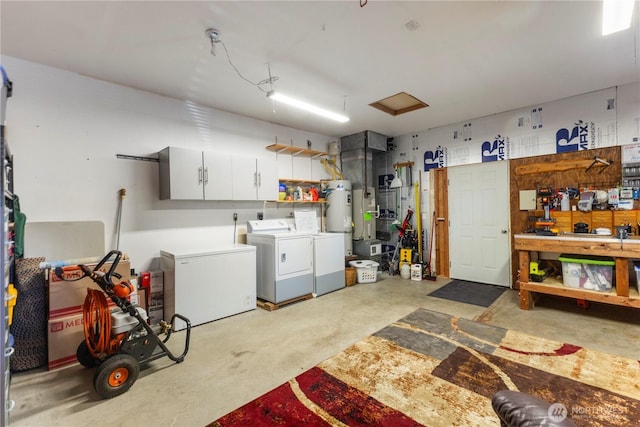81 E Dunoon Pl, Shelton, WA 98584 - garage featuring washer and dryer, fridge, heating unit, and water heater