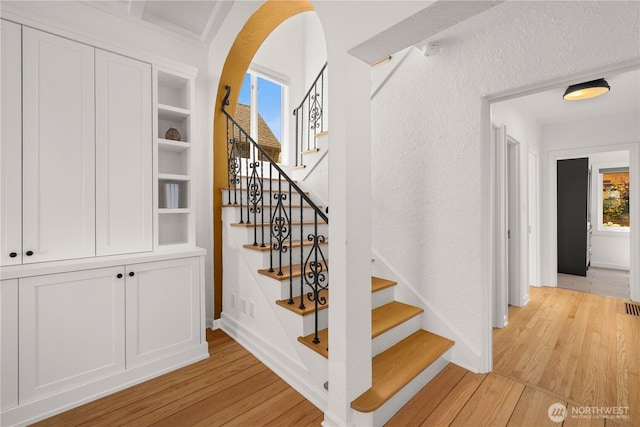 4315 52nd Ave NE, Seattle, WA 98105 - stairway with wood finished floors and a textured wall