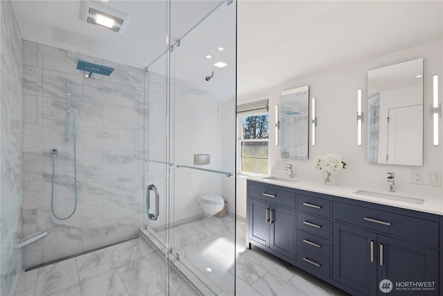 4315 52nd Ave NE, Seattle, WA 98105 - full bath featuring marble look tiles, double vanity, and a stall shower