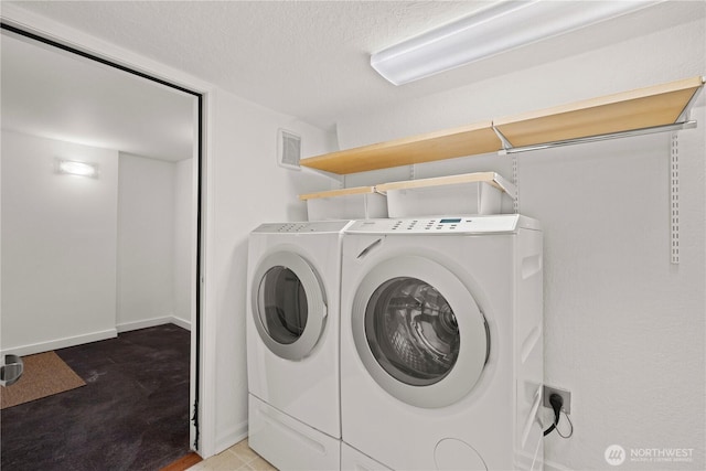 4315 52nd Ave NE, Seattle, WA 98105 - washroom featuring independent washer and dryer and a textured ceiling