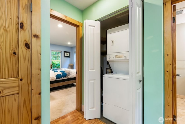 7493 Miller Way, Deming, WA 98244 - washroom featuring stacked washer / dryer and light wood-style floors