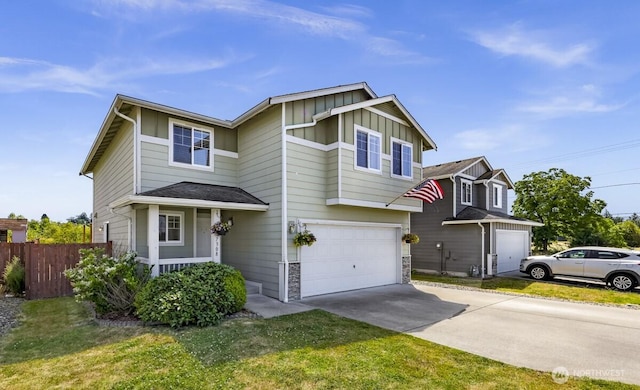 7308 Clamdigger Dr, Blaine, WA 98230 - view of front facade with board and batten siding, concrete driveway, a garage, and stone siding