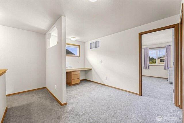 7308 Clamdigger Dr, Blaine, WA 98230 - empty room featuring carpet flooring and built in study area
