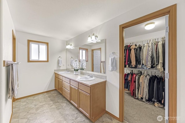 7308 Clamdigger Dr, Blaine, WA 98230 - full bathroom with double vanity, healthy amount of natural light, and a walk in closet