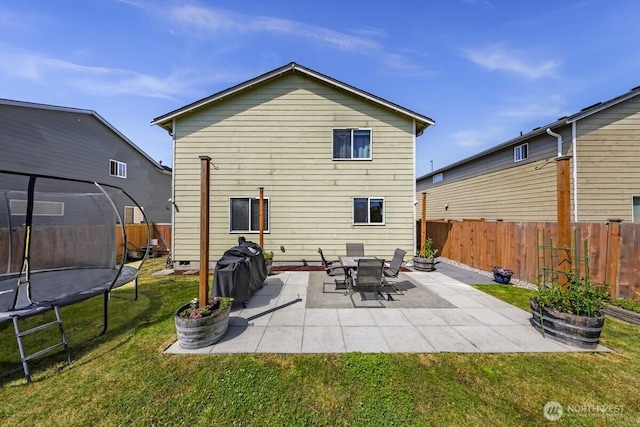 7308 Clamdigger Dr, Blaine, WA 98230 - rear view of property with a trampoline, a fenced backyard, and a patio area