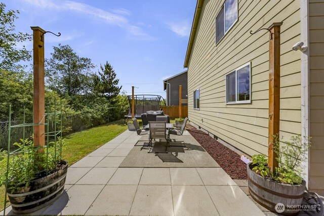 7308 Clamdigger Dr, Blaine, WA 98230 - fenced backyard with a patio and outdoor dining space
