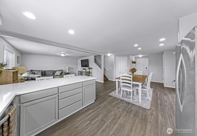 7308 Clamdigger Dr, Blaine, WA 98230 - kitchen with freestanding refrigerator, gray cabinetry, open floor plan, dark wood-style floors, and recessed lighting
