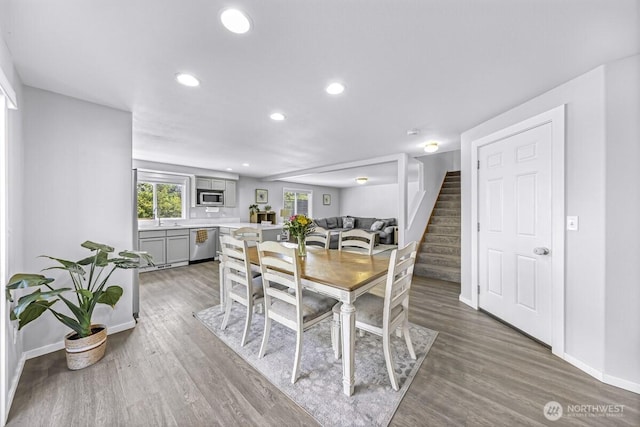 7308 Clamdigger Dr, Blaine, WA 98230 - dining room with stairway, wood finished floors, and recessed lighting