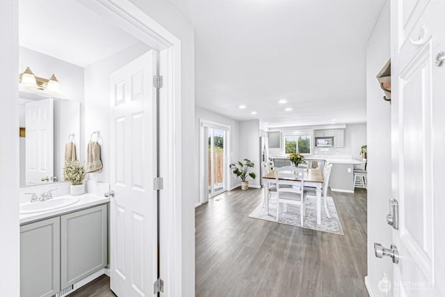 7308 Clamdigger Dr, Blaine, WA 98230 - bathroom featuring wood finished floors, vanity, and recessed lighting
