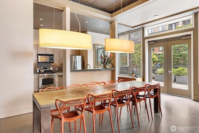2801 1st Ave Unit 501, Seattle, WA 98121 - dining area featuring concrete floors and french doors