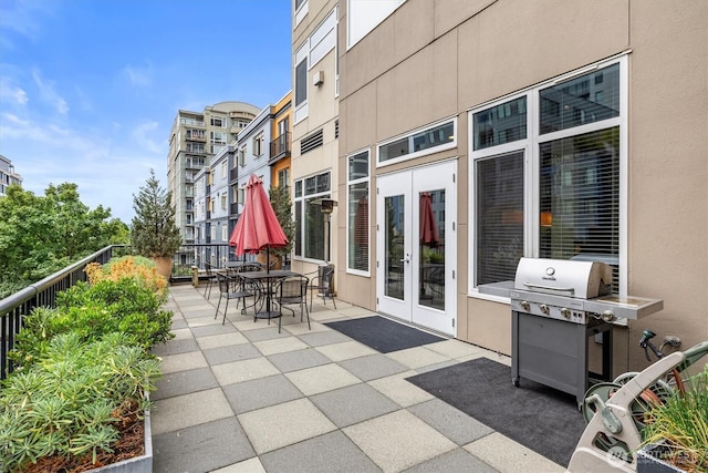 2801 1st Ave Unit 501, Seattle, WA 98121 - patio / terrace featuring grilling area and french doors