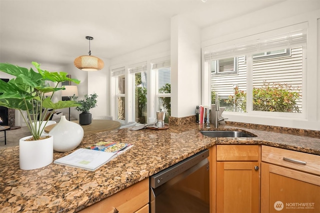 8615 238th St SW Unit B202, Edmonds, WA 98026 - kitchen with dishwashing machine, healthy amount of natural light, dark stone counters, and pendant lighting