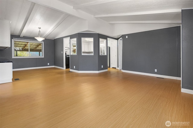 11500 Meridian Ave S Unit 22, Everett, WA 98208 - unfurnished living room featuring baseboards and wood finished floors