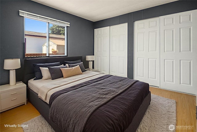 11500 Meridian Ave S Unit 22, Everett, WA 98208 - bedroom featuring light wood-style flooring and multiple closets