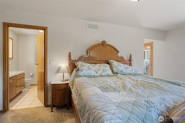 3613 Mcmullan Rd, Wenatchee, WA 98801 - bedroom featuring ensuite bath, light tile patterned flooring, and light carpet