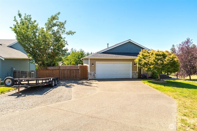 3761 Hannah Ct, Bellingham, WA 98226 - view of home's exterior with stone siding, concrete driveway, and a garage