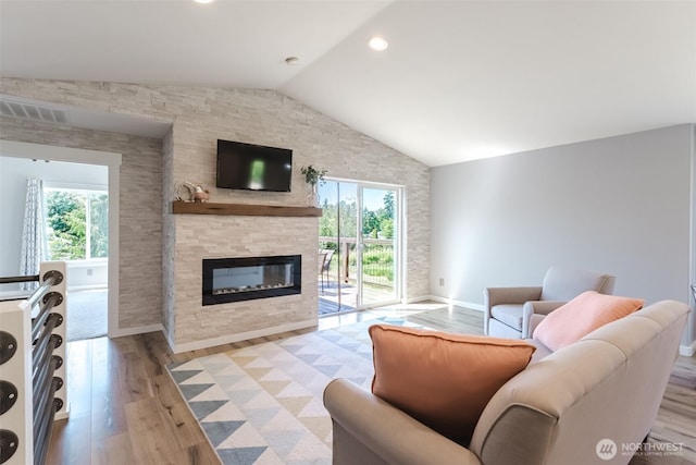 3761 Hannah Ct, Bellingham, WA 98226 - living area with lofted ceiling, light wood-style floors, and a stone fireplace