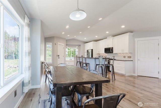 3761 Hannah Ct, Bellingham, WA 98226 - dining space with lofted ceiling, light wood finished floors, and recessed lighting