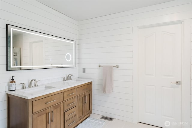 3761 Hannah Ct, Bellingham, WA 98226 - bathroom with double vanity, wooden walls, and tile patterned flooring