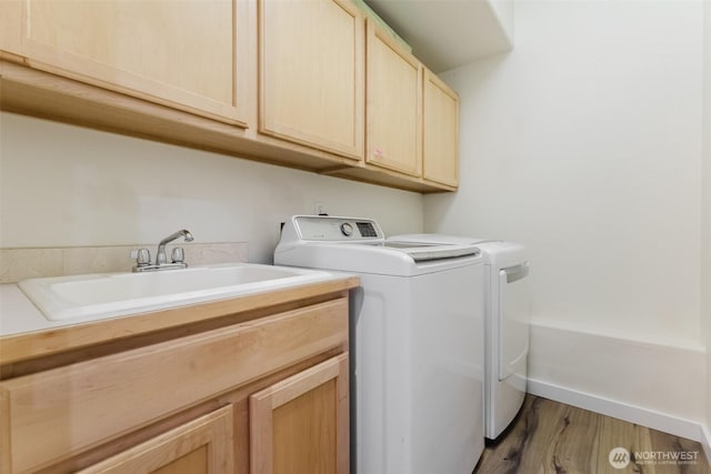 3761 Hannah Ct, Bellingham, WA 98226 - laundry area featuring washer and dryer, cabinet space, and wood finished floors