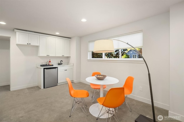 8841 Dibble Ave NW, Seattle, WA 98117 - dining room with wet bar, recessed lighting, and light colored carpet