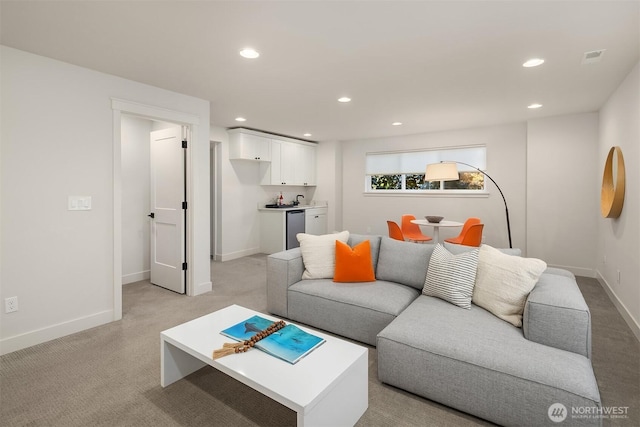 8841 Dibble Ave NW, Seattle, WA 98117 - living room with bar with sink, light carpet, and recessed lighting