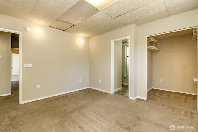1632 Aberdeen Ave NE, Renton, WA 98056 - unfurnished bedroom with carpet flooring, a drop ceiling, and a spacious closet