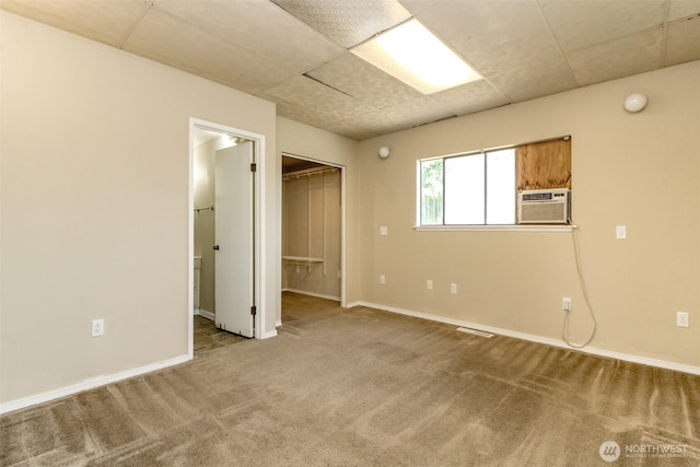 1632 Aberdeen Ave NE, Renton, WA 98056 - unfurnished bedroom with carpet flooring, a paneled ceiling, and a walk in closet