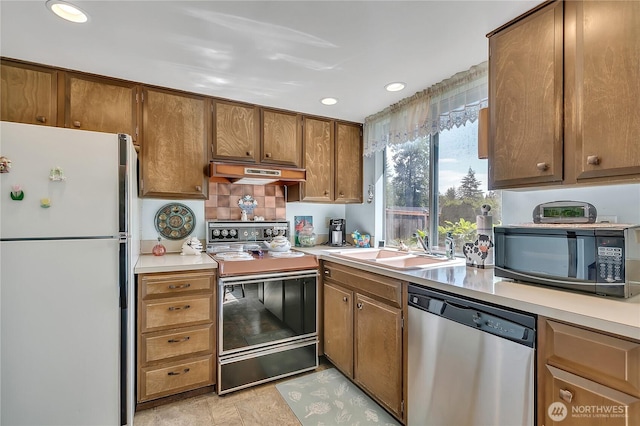 17004 137th Pl SE, Renton, WA 98058 - kitchen featuring freestanding refrigerator, dishwasher, electric stove, black microwave, and under cabinet range hood